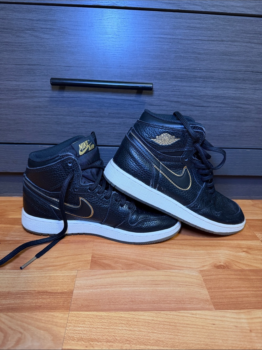 Jordan Black and Gold High-Top Sneakers